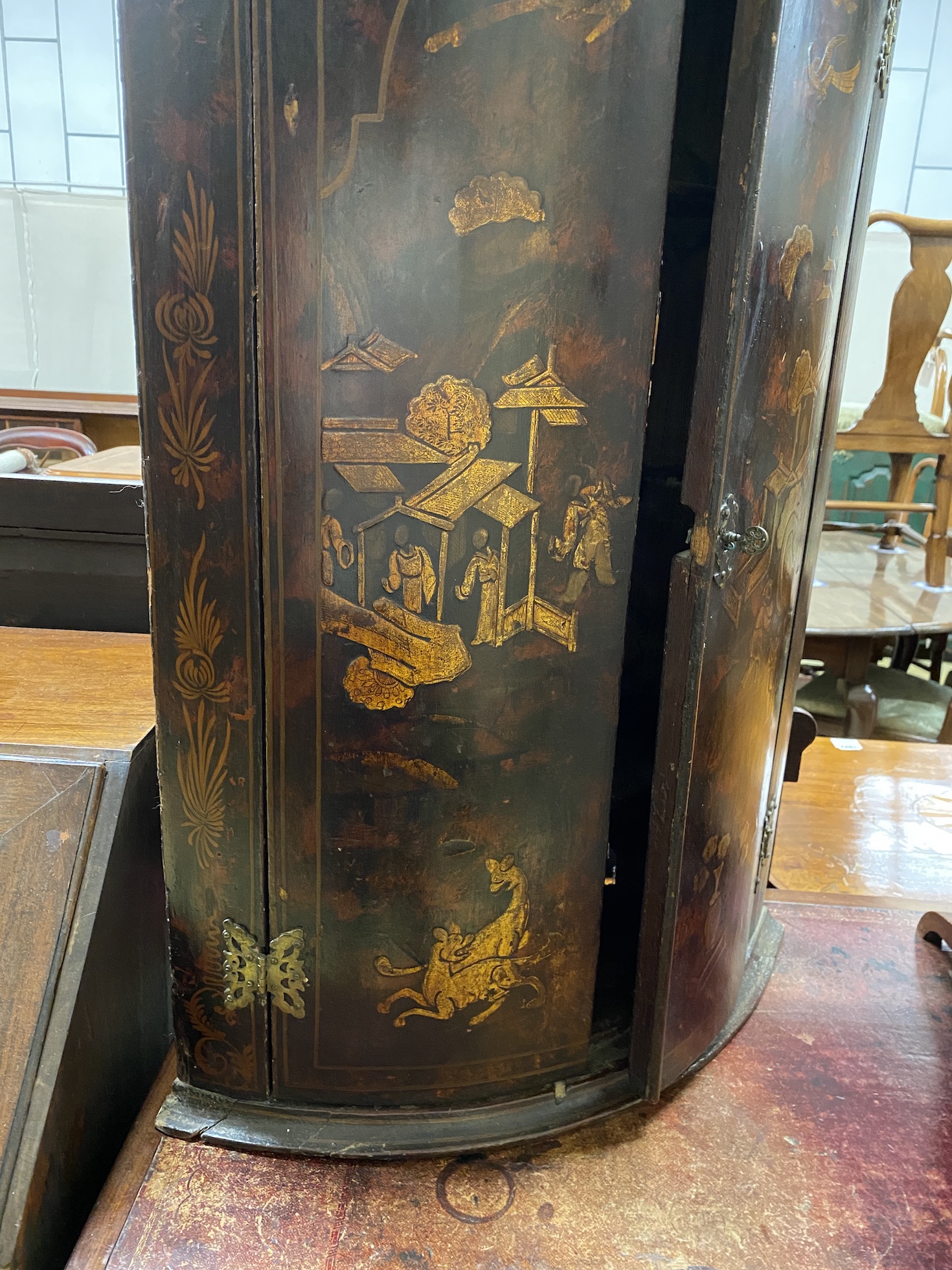 An 18th century chinoiserie lacquer bow front hanging corner cupboard, width 60cm, depth 40cm, height 92cm